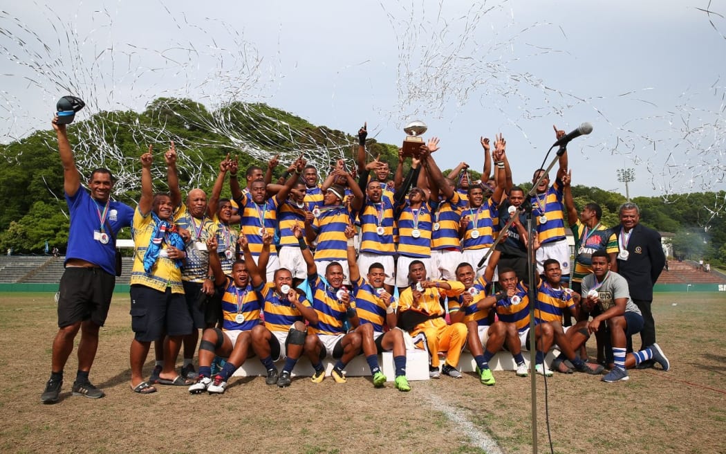 Ratu Kadavulevu School lift the trophy.