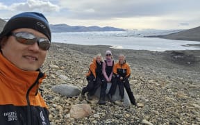 Microbial ecologist Dr Charles Lee and phD students in Antarctica.
