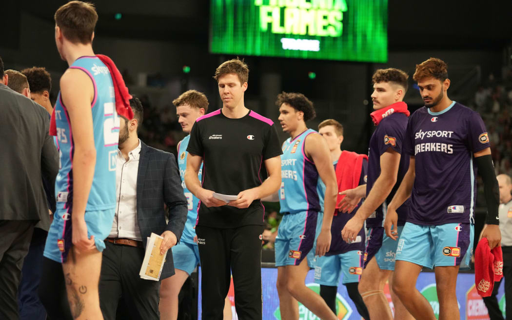 Tom Abercrombie of the New Zealand Breakers looks on from the bench.