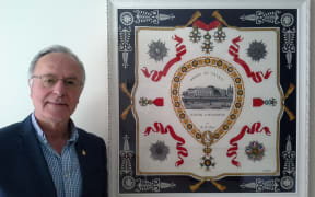 Des Schollum with Odette's Legion of Honour medal.