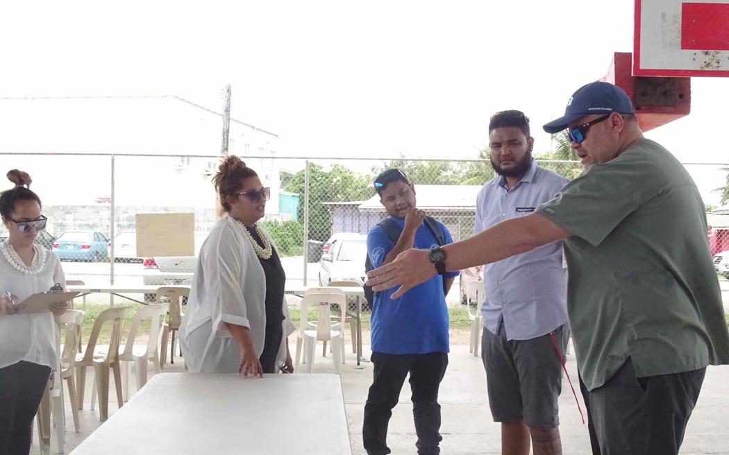 Marshall Islands Director of Public Health Dr. Frank Underwood, right, works with Ministry of Health and Human Services staff to prepare a "test and treat" facility at a Majuro school gymnasium as part of Covid-19 preparations in this file photo from June.