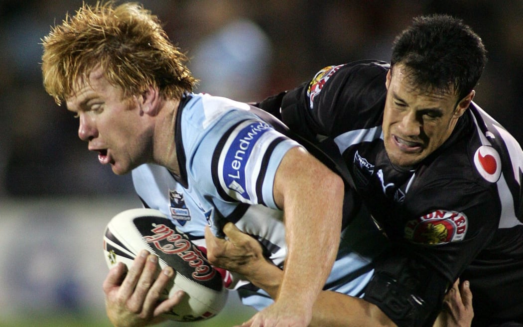 Lance Thompson is tackled by Logan Swann during an NRL match in 2007.