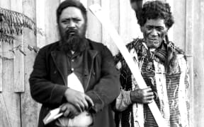 Mohi Tāwhai (right) holding his hoeroa and his son Hone, who went on to become an MP.