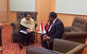 PNG Foreign Minister Rimbink Pato (right) talking to his Indonesian counterpart Retno Marsudi.