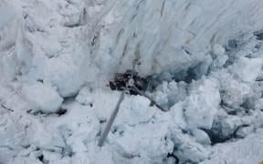 High resolution image of the wreckage of a helicopter on the Fox Glacier in 2015.