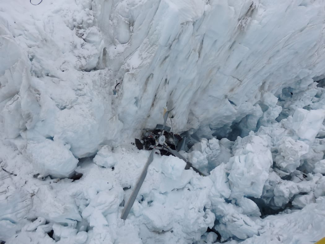 High resolution image of the wreckage of a helicopter on the Fox Glacier in 2015.