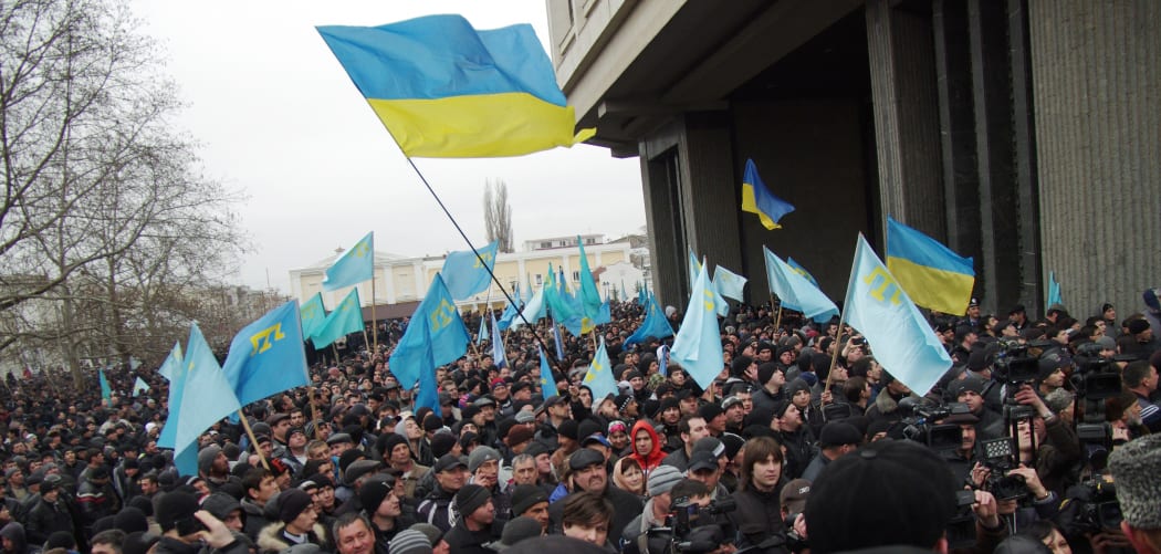 Pro-Ukrainian activists rally in front of the Crimean parliament in Semfiropol on February 26, 2014.