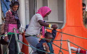 Women and children are among the scores of migrants arriving in Sicily after attempting to cross the Mediterranean Sea.