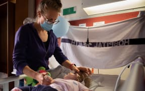 Lauren and her mother Rachel Malcolm-Swindells in her room at Wellington Regional Hospital children's ward