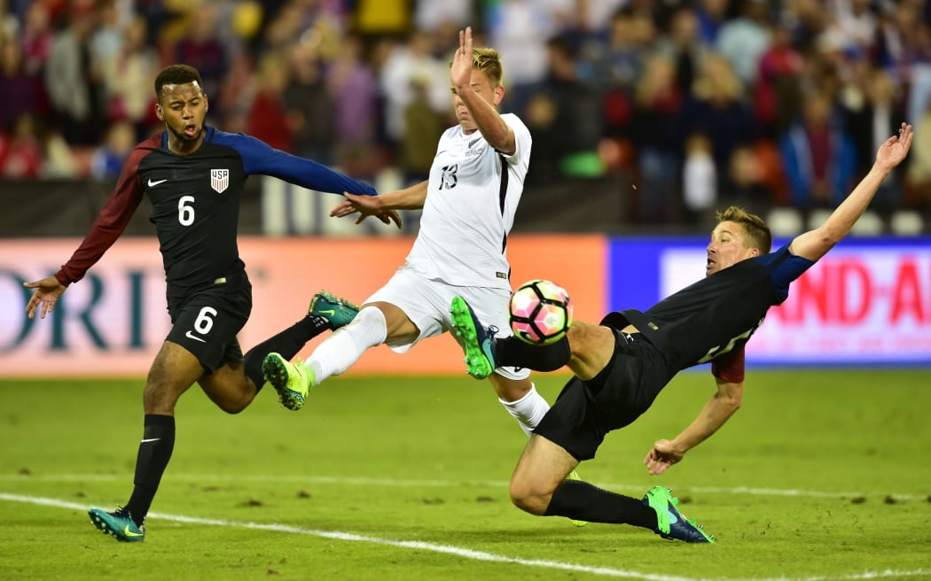 The All Whites' Monty Patterson contests possession against the United States in Washington DC in 2016.