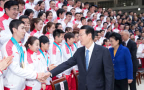 (180227) -- BEIJING, Feb. 27, 2018 (Xinhua) -- Chinese Vice Premier Zhang Gaoli meets with the Chinese delegation that returned home after the PyeongChang Winter Olympics, in Beijing, capital of China, Feb. 27, 2018.