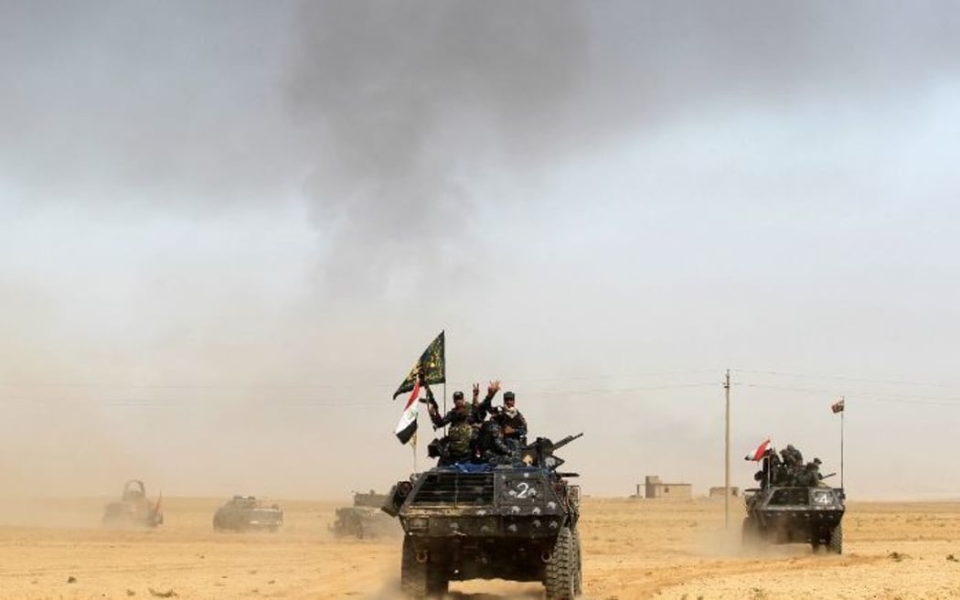 Iraqi forces in the area of al-Shurah, 45 km south of Mosul, as they advance towards the city to retake it from IS.