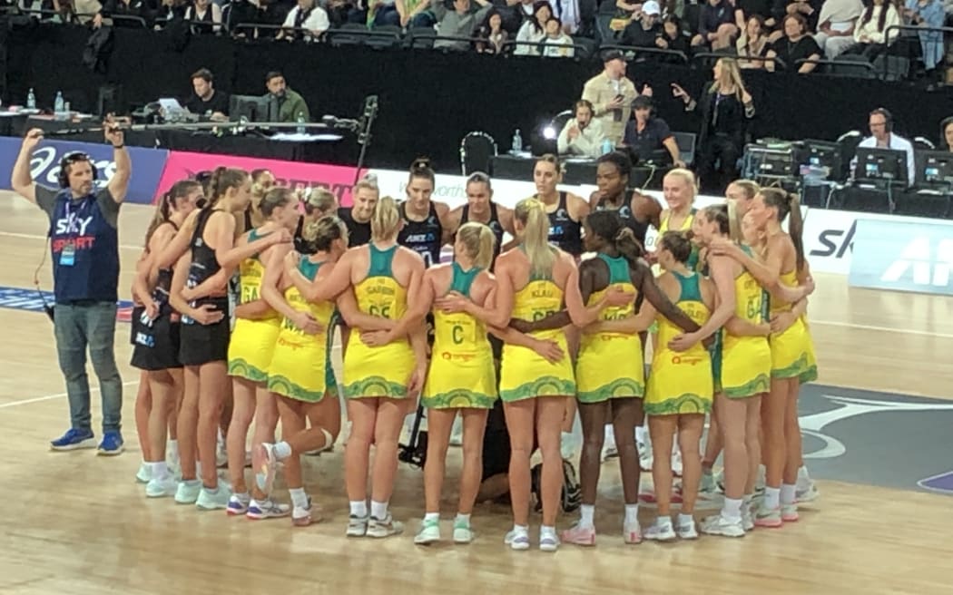 The Australian Diamonds and Silver ferns in a huddle at their final Constellation Cup match of 2023. The Ferns won the battle, but the Diamonds took the trophy on goal difference