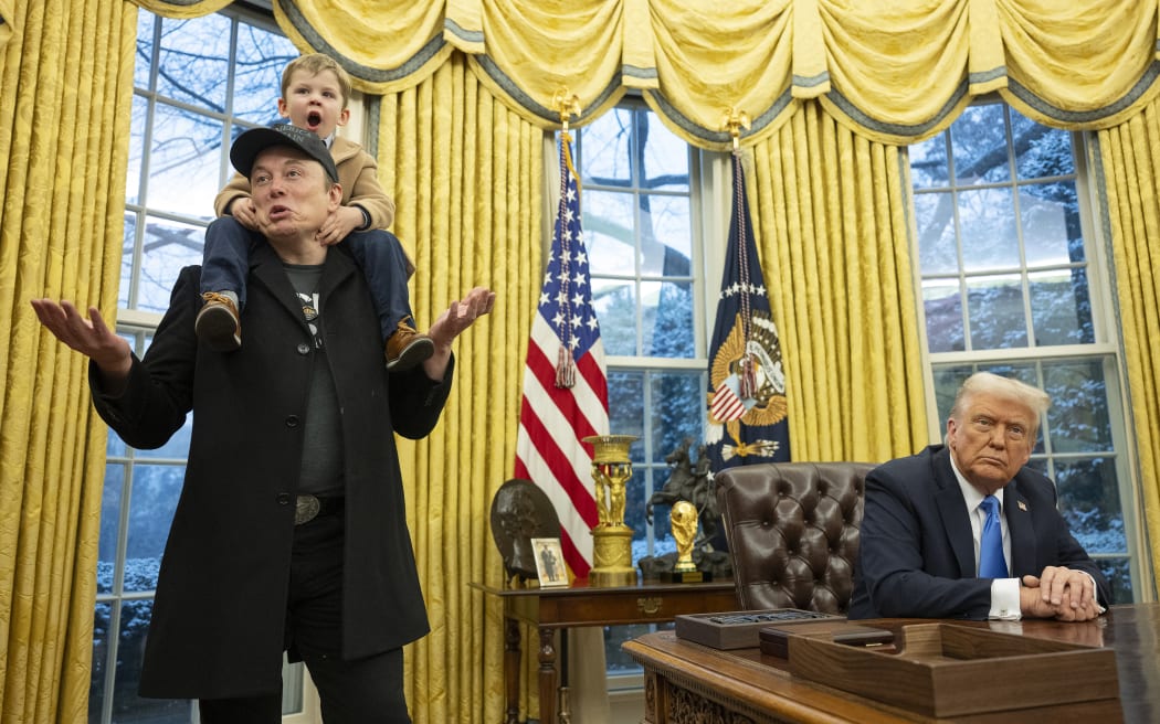 Tesla and SpaceX CEO Elon Musk with his son X Æ A-Xii join US President Donald Trump as he signs executive orders in the Oval Office of the White House in Washington, DC, 11 February 2025.