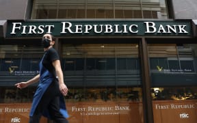 SAN FRANCISCO, CALIFORNIA - MARCH 13: A person walks by the First Republic Bank headquarters on March 13, 2023 in San Francisco, California. First Republic shares lost over 60 percent on Monday even after regulators took actions Sunday evening to backstop all depositors in failed Silicon Valley Bank and Signature Bank and offer additional funding to other troubled institutions.   Justin Sullivan/Getty Images/AFP (Photo by JUSTIN SULLIVAN / GETTY IMAGES NORTH AMERICA / Getty Images via AFP)