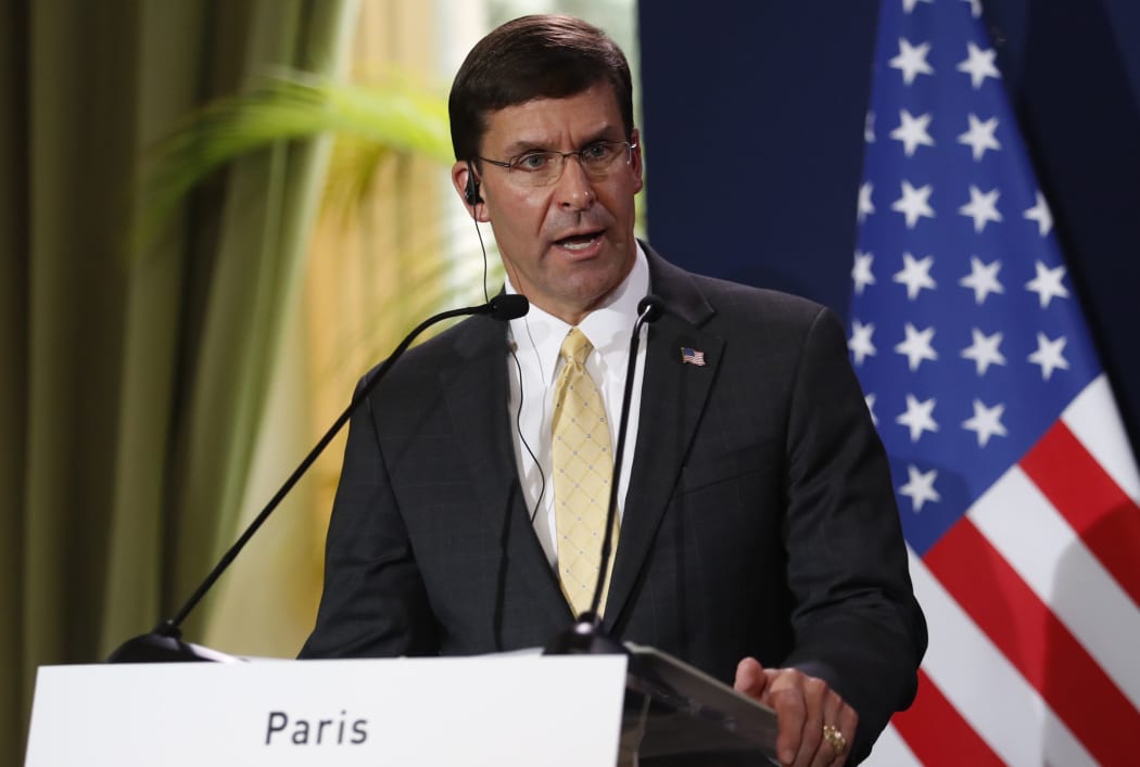 (FILES) In this file photo taken on September 07, 2019 US Secretary of Defense Mark Esper (L) holds a press conference