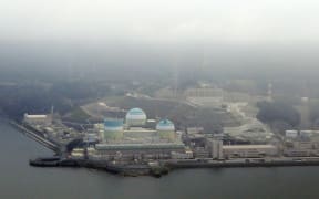 The Ikata nuclear power plant, operated by Shikoku Electric Power plant has remained suspended  in Ikata, Ehime Prefecture on March 17, 2021. Hiroshima High Court odered the electric compnay to  stop  No. 3 reactor (L) reactivation because of a damage possibility  of Mt. Aso eruption.  The High Court will order on March 18 to make a decision on restarting or halting of the nuclear plant. ( The Yomiuri Shimbun ) (Photo by Kota Kawasaki / Yomiuri / The Yomiuri Shimbun via AFP)