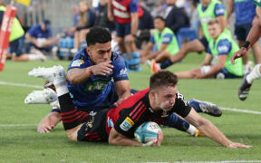Fergus Burke of the Crusaders scores a try during the Super Rugby Pacific match between the Blues and the Crusaders at Eden Park in Auckland, New Zealand on Saturday 18 March 2023. Copyright photo: David Rowland / www.photosport.nz