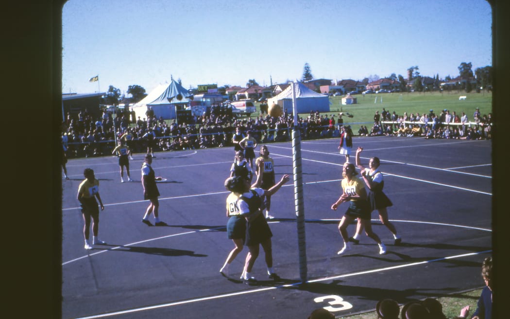 Joan Harnett shoots a goal for the Silver Ferns. Harnett played for New Zealand between 1963 and 1971.
