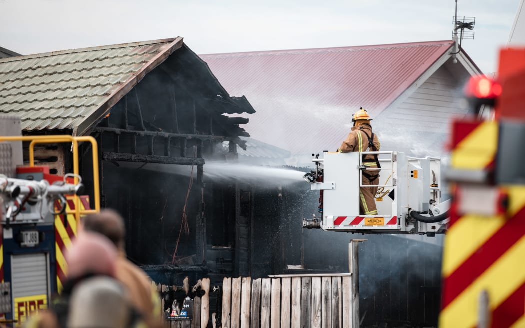 Firefighters tackling a blaze in a house on Yule Street, Kilbirnie, Wellington