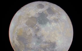 The super blue moon, as taken with a 10-inch telescope a backyard in Auckland. The picture shoes the different mineral compositions of the moon's surface, to see many beautiful colors.