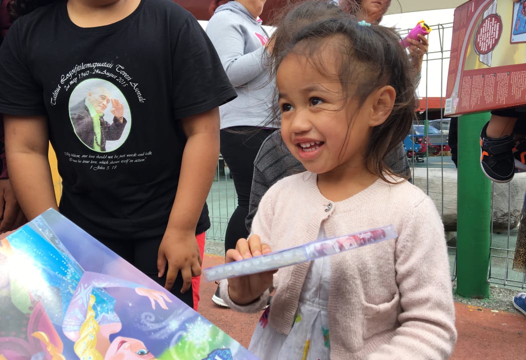 Waitangirua community Christmas Party. Locals received a free sausage sizzle, some received food hampers and christmas gifts were handed out to the children.
