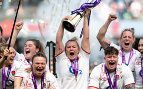 England captain Marlie Packer lifts the Six Nations trophy