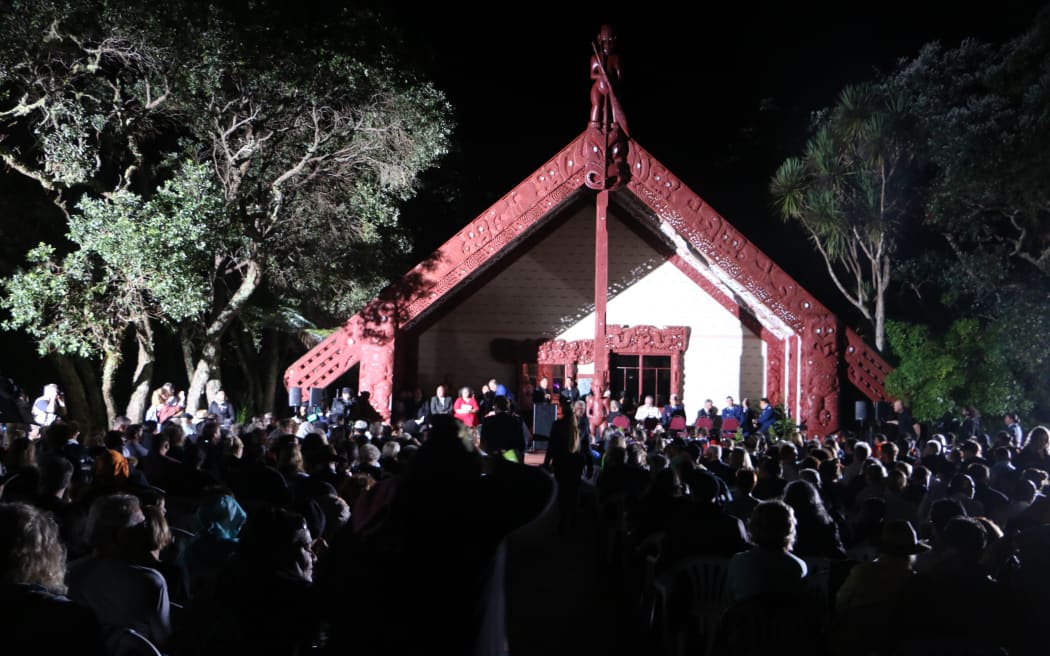 Hundreds gather in the dark at Te Tiriti o Waitangi marae for Waitangi Day celebrations.