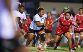 Fijiana women's rugby team on the attack against Tonga in Brisbane on Friday night. Fiji won 48-3. Photo: Oceania Rugby