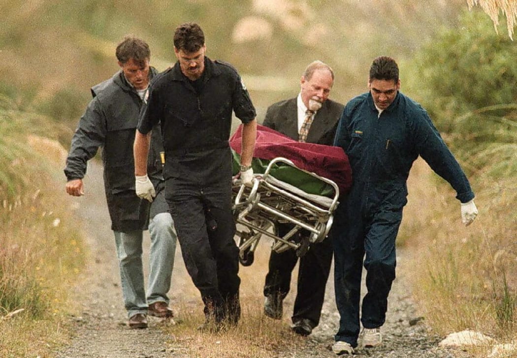 Emergency personnel bring out one of the six bodies from Saturday's 08 February shooting at the small New Zealand hamlet of Raurimu 09 February. AFP PHOTO. (Photo by HO / THE DOMINION / AFP)