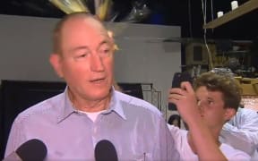 The moment a young man broke an egg on Australian Senator Fraser Anning's head.