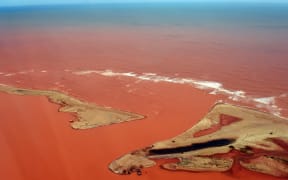 An aerial view of the Doce River which was flooded with toxic lama after a dam burst.
