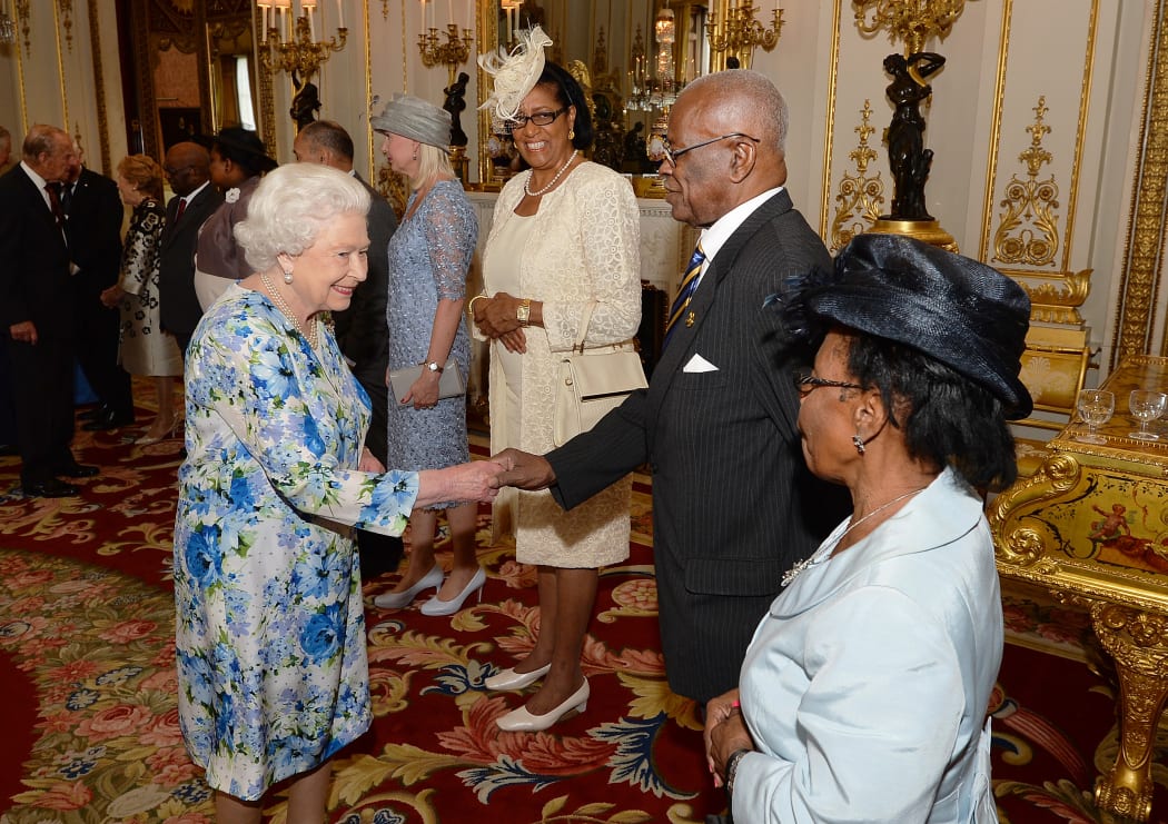 The Queen shakes hands with the Governor-General of Barbados, Elliott Belgrave, during a reception ahead of the Governor General's lunch in honour of the Queen's 90th birthday at Buckingham Palace in London, June 10, 2016.