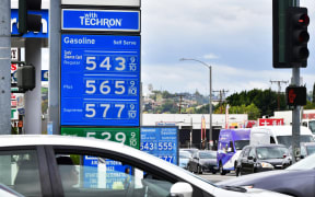 Gas prices of over $5 a gallon are posted at a petrol station in Alhambra, California on March 4, 2022. - Californians filling up their cars on March 4, 2022, winced at the spiraling cost of gasoline, but largely shrugged as residents of the state that has long had the highest gas prices in the United States.