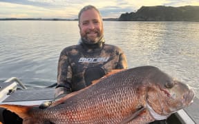 Musician and fisherman Gerry Paul fishing in Northland