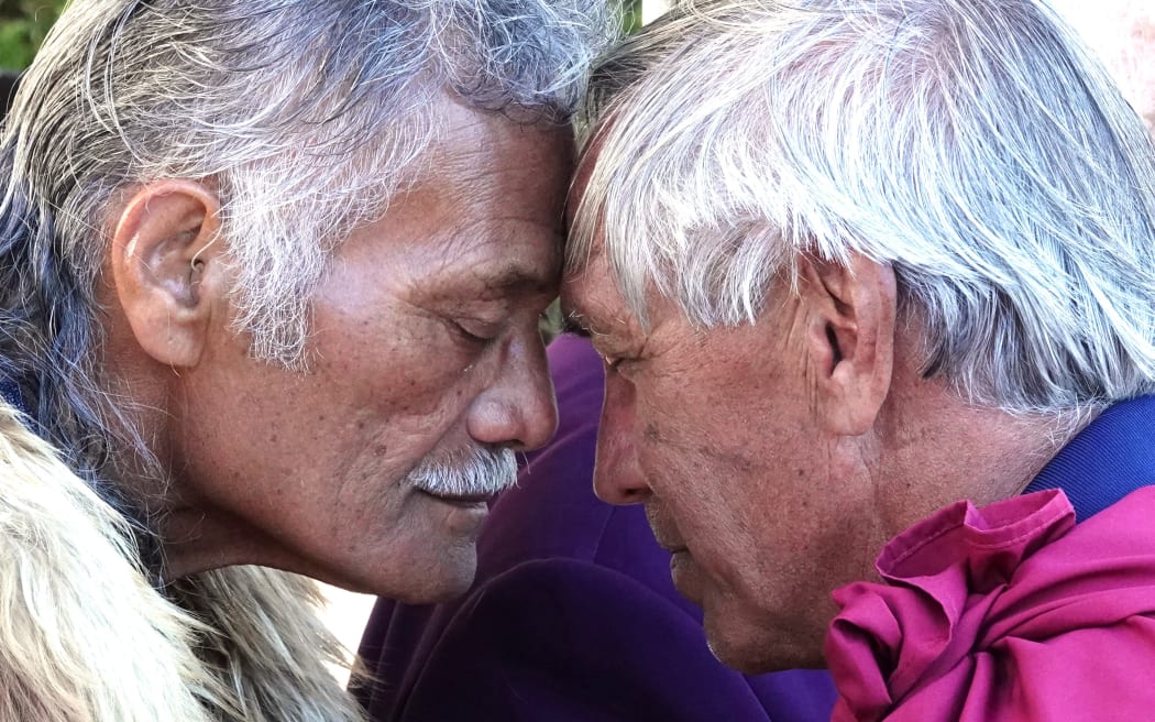 Polynesian Voyaging Society chief executive Nainoa Thompson (right) shares a hongi with Albie Apiata of Te Tii Marae.