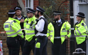 Police officers outside Parsons Green Station after the attack.