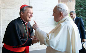 This handout picture taken and released on October 9, 2021 by Vatican Media shows Pope Francis (R) speaking with Cardinal Mario Grech of Malta during the opening of the Synod at the Vatican. (Photo by VATICAN MEDIA / AFP) / RESTRICTED TO EDITORIAL USE - MANDATORY CREDIT "AFP PHOTO/ VATICAN MEDIA" - NO MARKETING - NO ADVERTISING CAMPAIGNS - DISTRIBUTED AS A SERVICE TO CLIENTS - RESTRICTED TO EDITORIAL USE - MANDATORY CREDIT "AFP PHOTO/ VATICAN MEDIA" - NO MARKETING - NO ADVERTISING CAMPAIGNS - DISTRIBUTED AS A SERVICE TO CLIENTS /