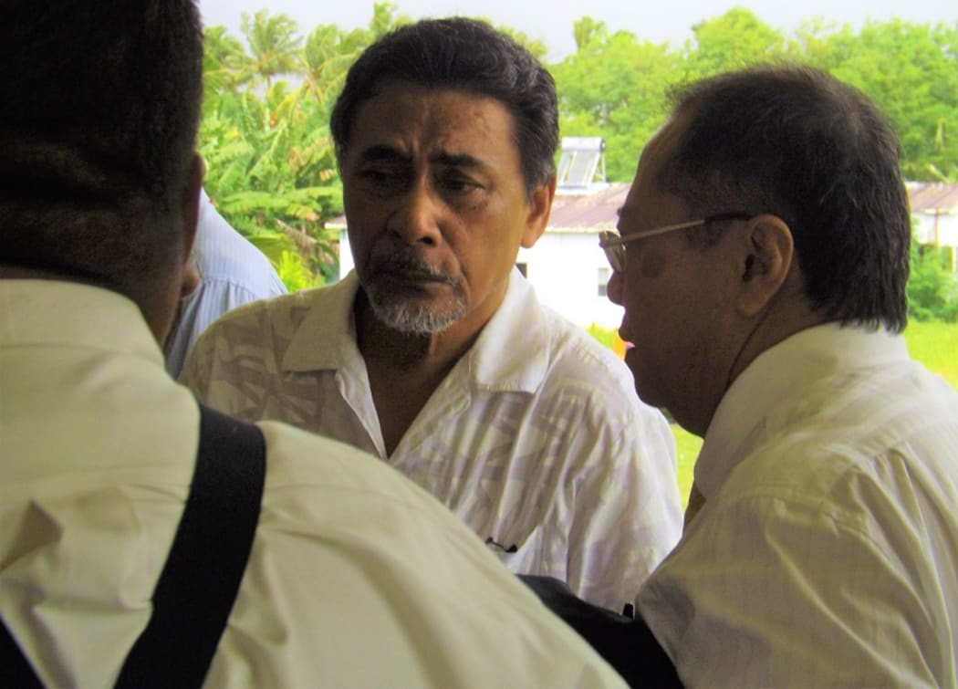 Apulu Lance Polu talking to his lawyer post-verdict
