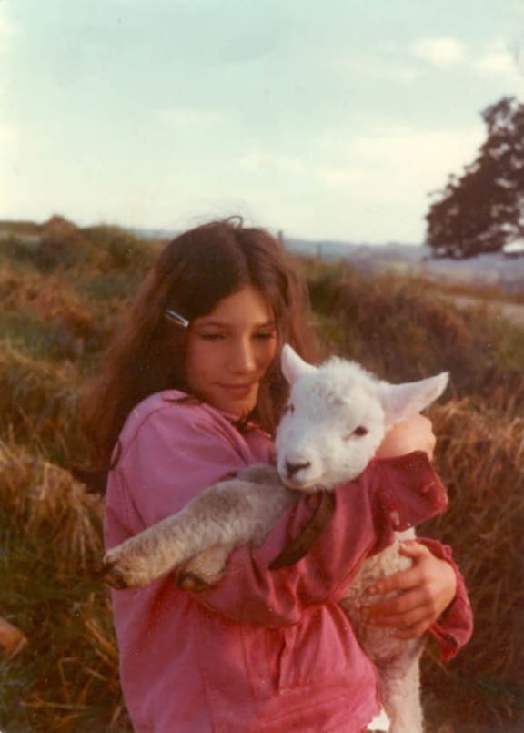 An 11-year-old Zoe Helene in New Zealand, with her pet lamb Wai.