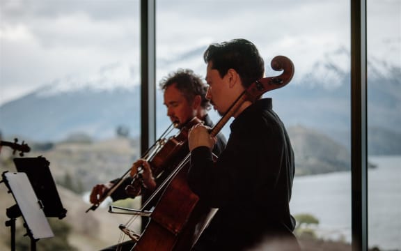 Cellist and viola player on stage.