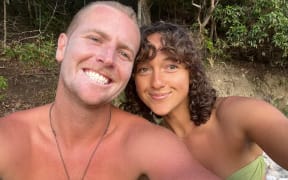 Data shows record numbers of Kiwis, including Sam and Sophie, are leaving New Zealand.