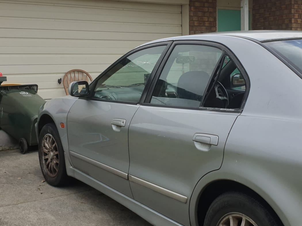 A car with a cracked windscreen at the scene of a shooting on Naylors Drive in Mangere.