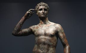 The statue known as "Victorious Youth" is displayed at the Getty Villa on December 13, 2018 in Los Angeles, California. ECHR ruled on May 2, 2024 in favour of Italy on its dispute with the Getty Foundation over the ownership of the 2000-year-old bronze Greek statue, following Italy's top court ruling that it should be returned to Italy by the Getty museum. Italian officials say the statue was found in Italian territorial waters while the Getty Trust argues the statue was discovered in international waters. (Photo by Mario TAMA / GETTY IMAGES NORTH AMERICA / AFP)
