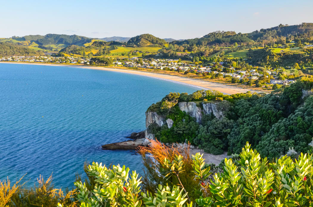 Sunset View of Cooks Beach from Shakespeare Cliff Lookout at Coromandel Peninsula, North Island, New Zealand.