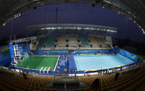 The diving pool at Maria Lenk Aquatics Stadium is a murky green before the Women's Synchronised 10m Platform Final at the Rio 2016 Olympic Games