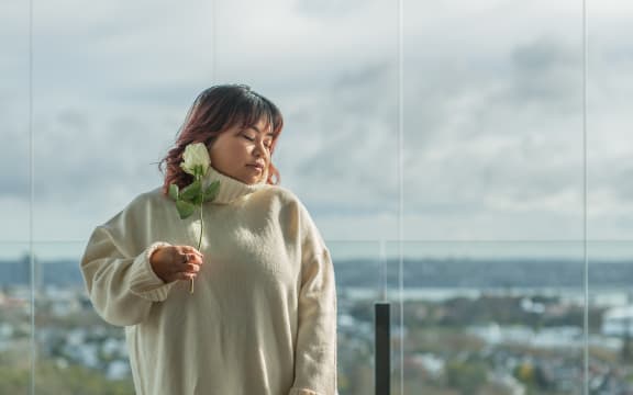 Amanda poses in a comfy sweater