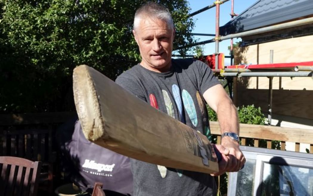 New Zealand's World Cup operations manager, Gavin Larsen, swings a bat at home.
