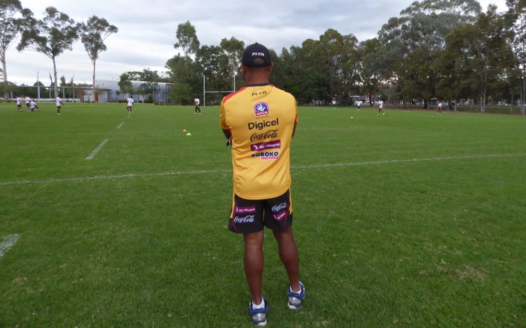 PNG Kumuls coach Michael Marum surveys training.