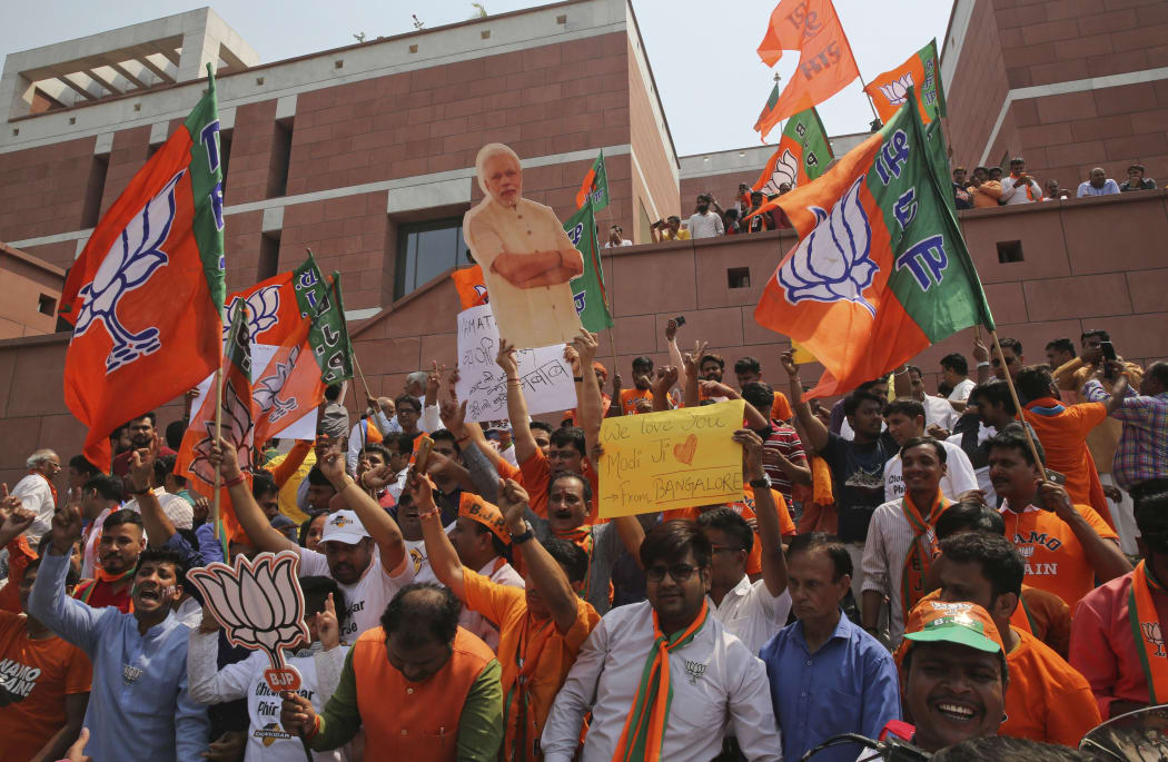 Bharatiya Janata Party (BJP) supporters celebrate their party's victory.